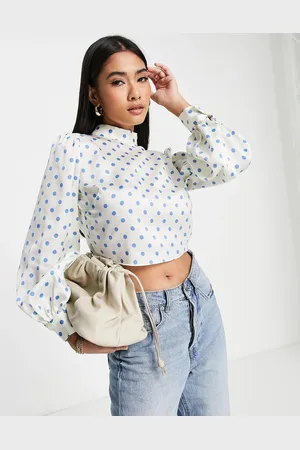 River Island Polka dot tie back high neck blouse is