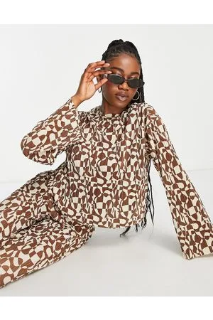 Monki Co-ord long sleeve plisse top in brown retro circle print