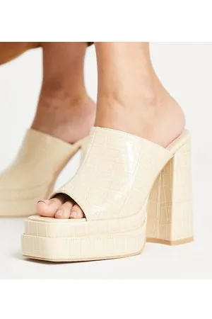 Raid Piya platform heel mules in ecru croc