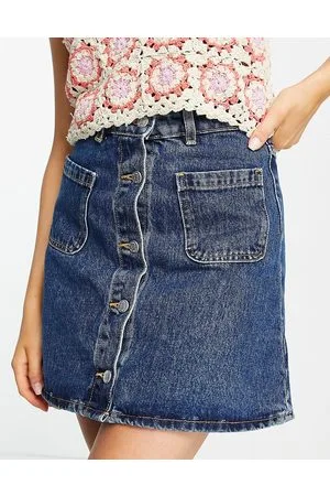 Monki Button through mini skirt with front pockets in mid wash denim
