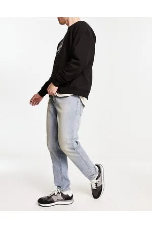 ASOS Tapered jeans in vintages light wash with 90s tint