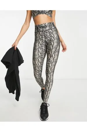 Pink Soda Sport Adder polyester blend legging with snake print in stone