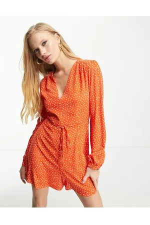 Glamorous V neck tie waist tea playsuit in red orange ditsy