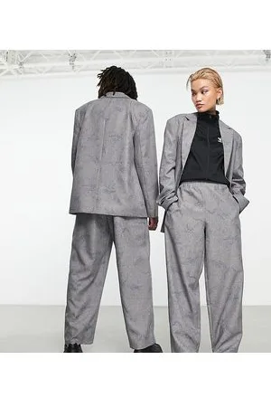 COLLUSION Unisex trousers with elasticated waistband in light with blue print