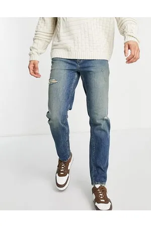ASOS Stretch tapered jeans in tinted wash with abrasions