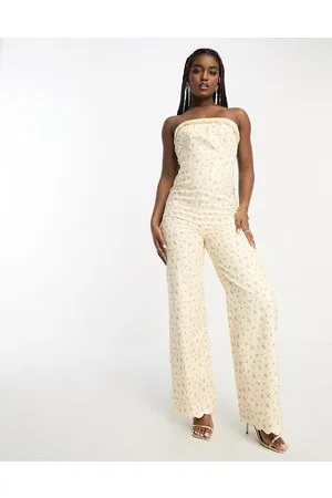 The Frolic Strapless wide leg jumpsuit with scallop hem in vintage floral