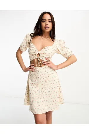 The Frolic Milkmaid mini dress with cut out bodice in vintage floral