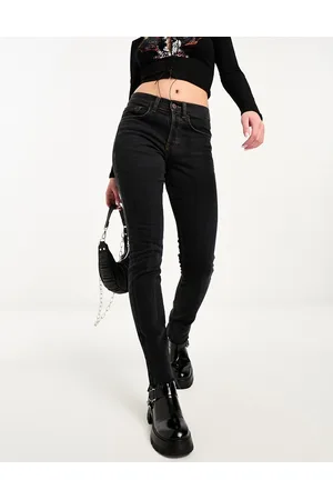 COLLUSION X001 mid rise drainpipe skinny jeans in washed with raw hem