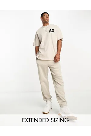 Armani Exchange Logo joggers in beige mix and match