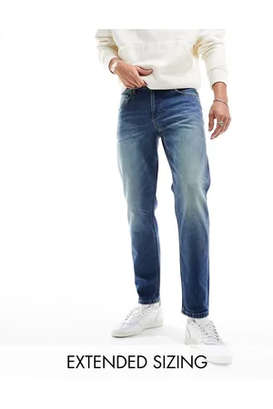 ASOS Stretch tapered jeans in tinted vintage wash