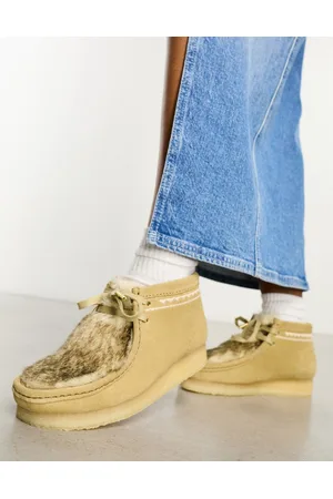 Clarks Wallabee boots in tan faux fur