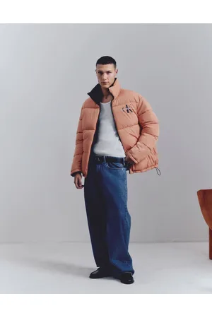 Calvin Klein Reversible 90s puffer jacket in orange