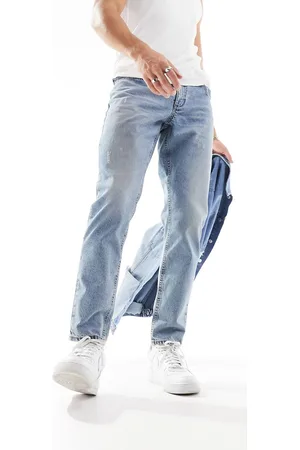 ASOS Vintage tapered jeans with abrasions in mid wash tint