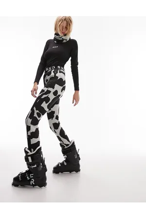 Topshop Sno cow print stretch slim leg ski trouser with stirrups in