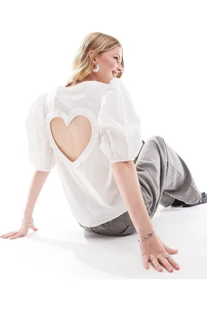 Monki Volume short sleeve v neck blouse with open back heart detail in
