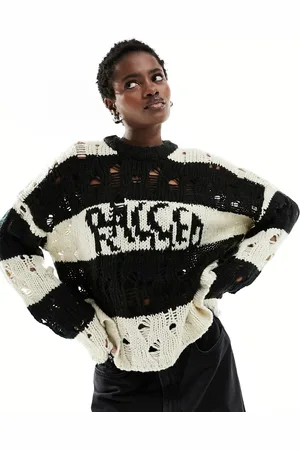 The Ragged Priest Distressed jumper with intarsia logo in monochrome stripe