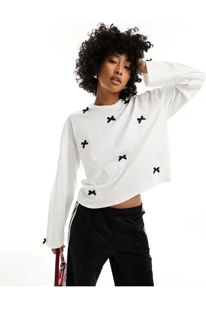 Monki Long sleeve top with contrasting satin bows in light off