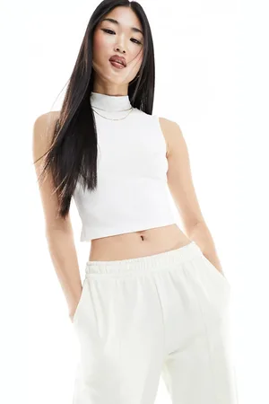 EDITED the label High neck ribbed top in cream