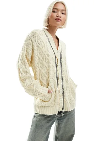The Ragged Priest Oversized cable knit cardigan with charm zips in cream