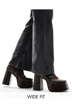 ASOS Knee high platform heeled boots in snake print faux leather