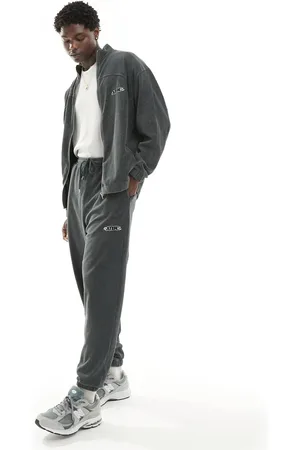 ASOS Oversized ribbed velour joggers in washed charcoal