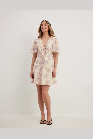 NA-KD Tie front chiffon mini dress with floral print in beige