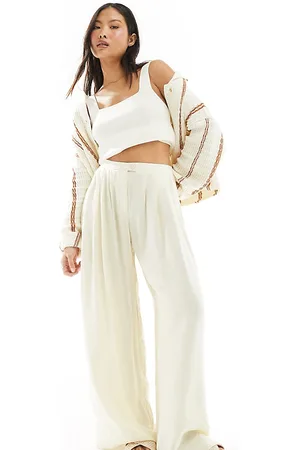 Stradivarius Petite fluid pleat front trouser in buttermilk