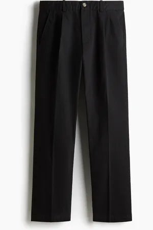 H&M Regular Fit chinos med press nedover bena