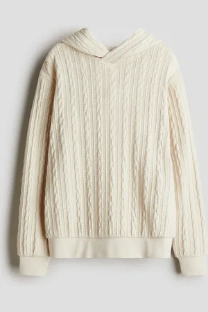 H&M Hettegenser i flettestrikket look