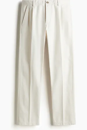 H&M Regular Fit chinos med press nedover bena